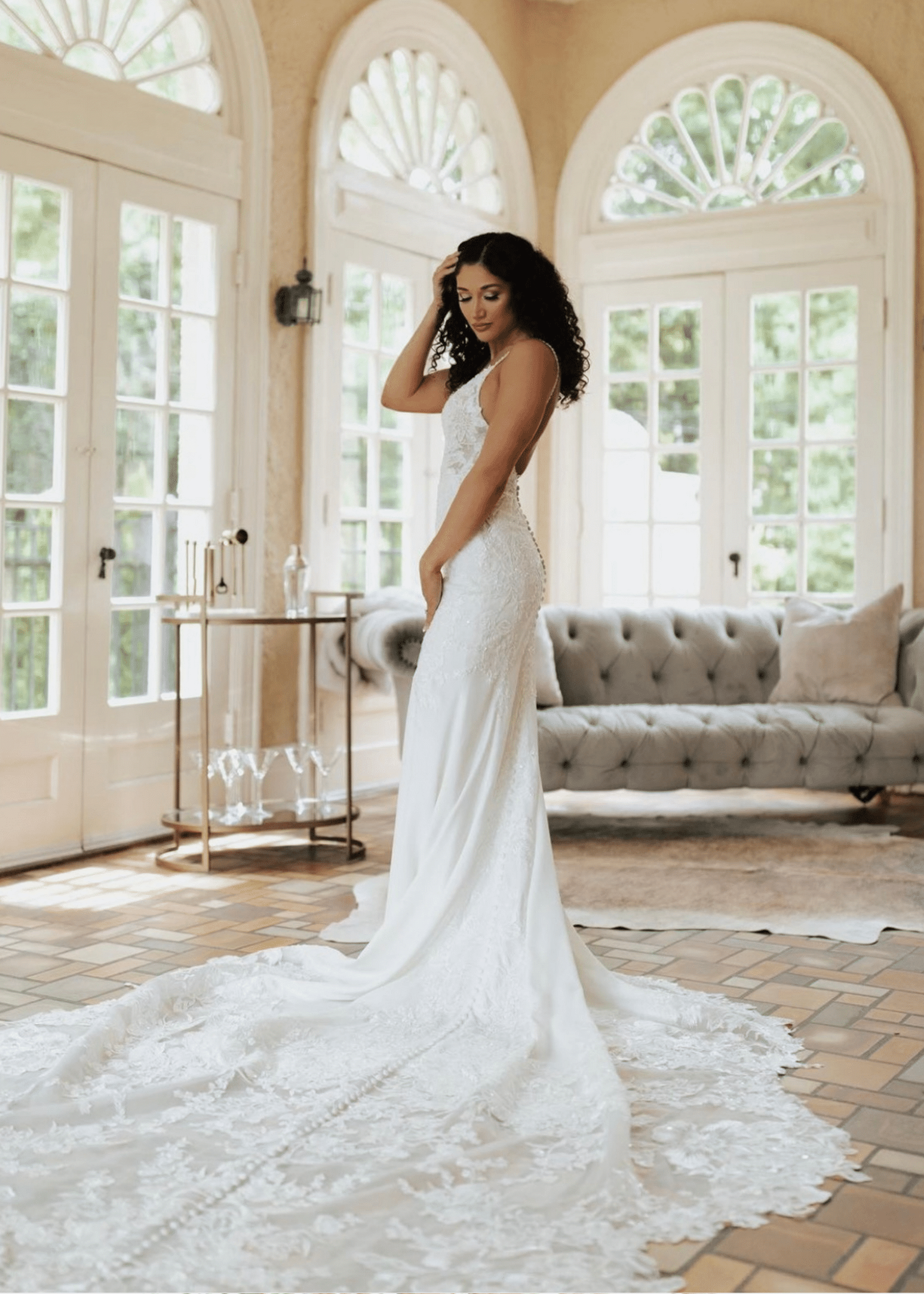 Model wearing a white gown at home
