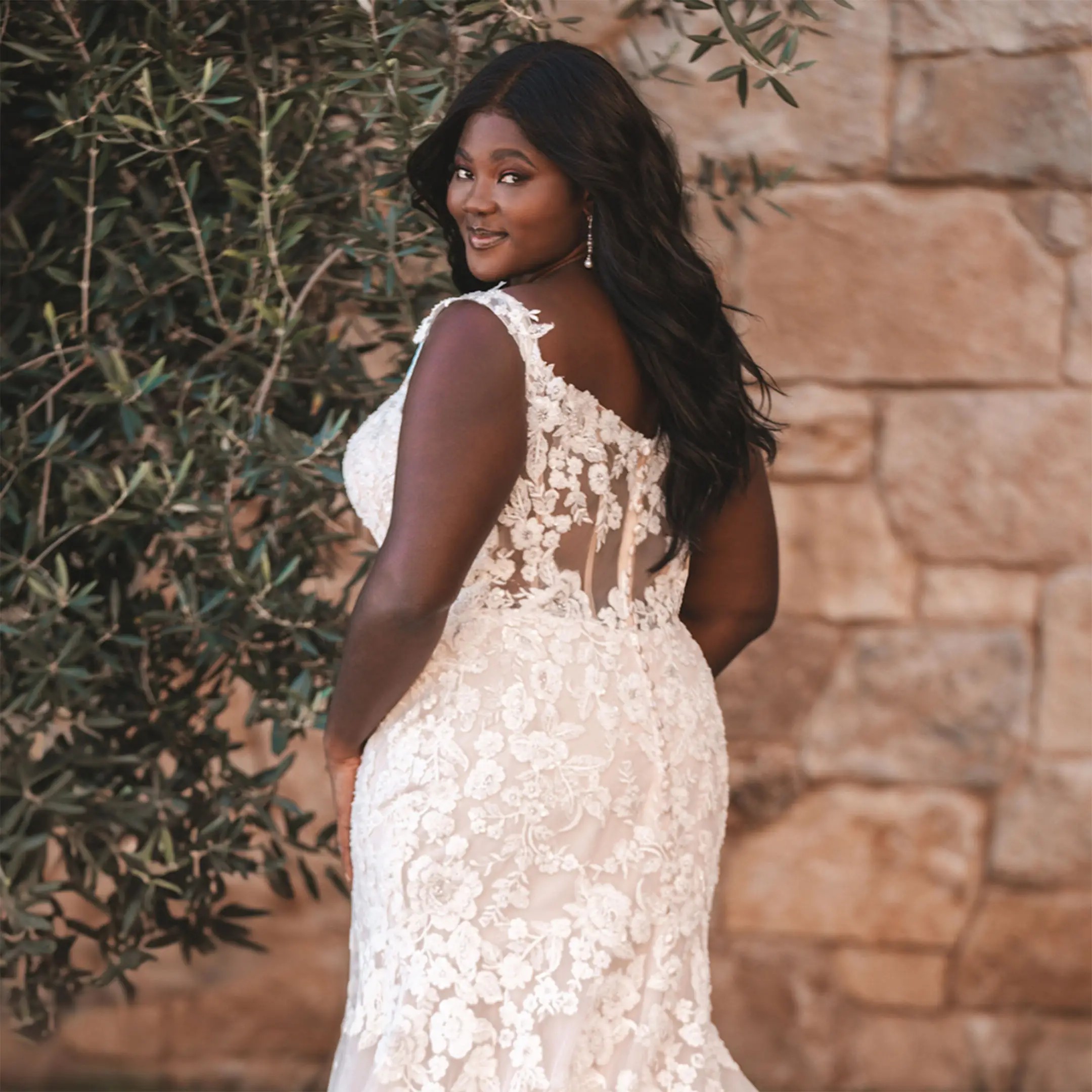 Plus Size Model wearing white lace wedding dress