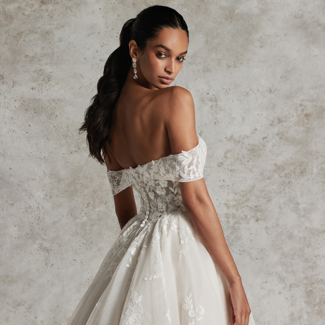 Model wearing white ballgown dress